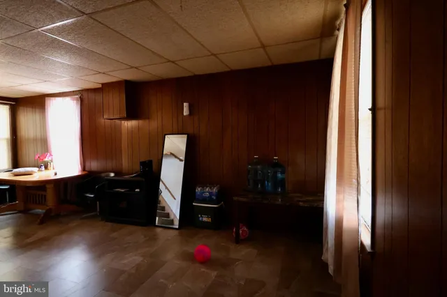 a workspace with furniture and bathroom