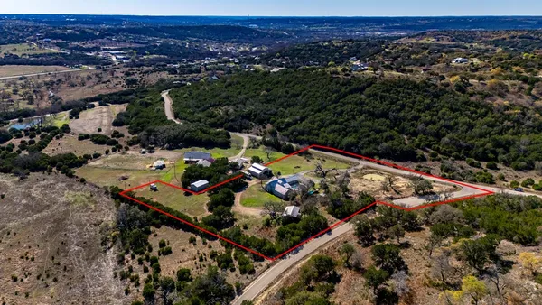 a kitchen with lots of counter top space and wooden floor