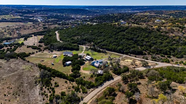 a kitchen with granite countertop lots of counter top space and wooden floor