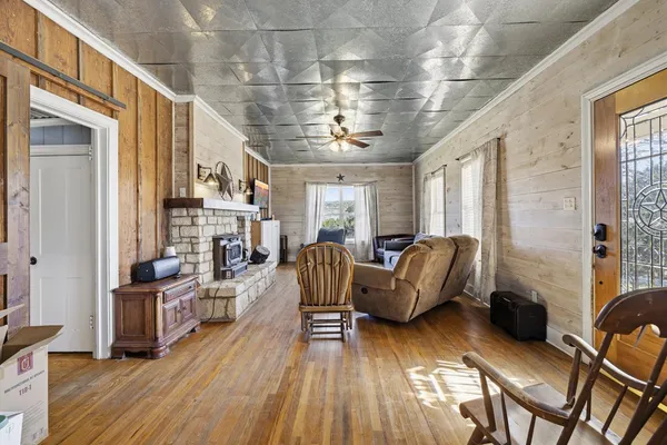 a view of a livingroom with furniture and windows