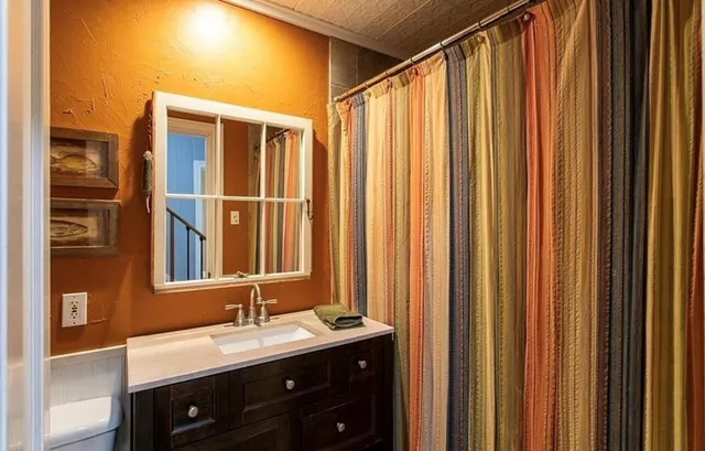 a bathroom with a double vanity sink and mirror