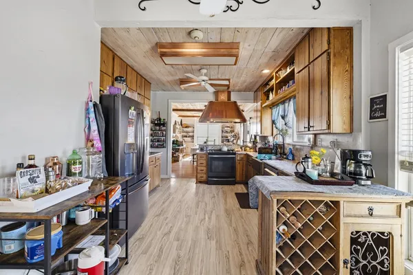 a view of a livingroom with furniture and windows