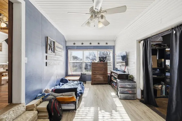 a bedroom with a bed furniture and a window