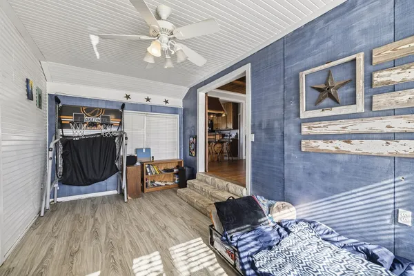 a bedroom with furniture and a window