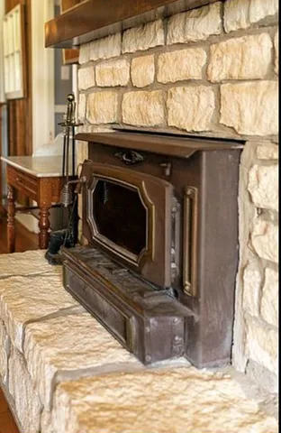 a view of a fireplace and a window