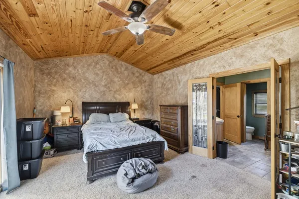 a view of a house with swimming pool and sitting area