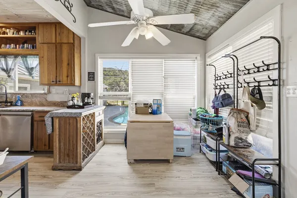a kitchen with granite countertop lots of counter top space and wooden floor