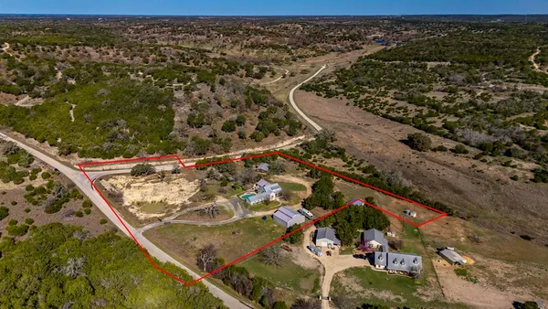 an aerial view of a golf course with parking space