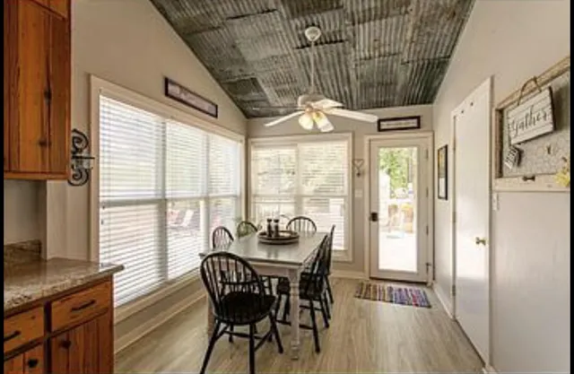 a dining room with furniture window wooden floor