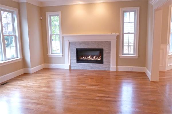 604 High Rock Street Needham, MA 02492 - Photo 5 of 9 an empty room with wooden floor fireplace and windows