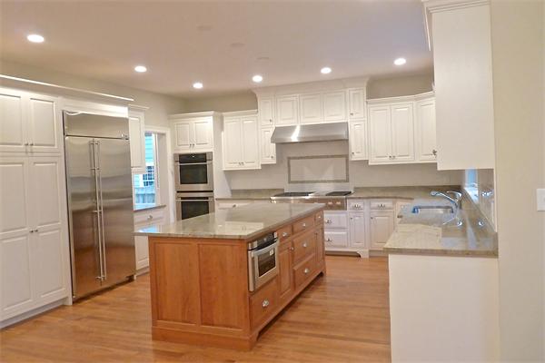 604 High Rock Street Needham, MA 02492 - Photo 6 of 9 a kitchen with stainless steel appliances granite countertop a stove a sink and a refrigerator