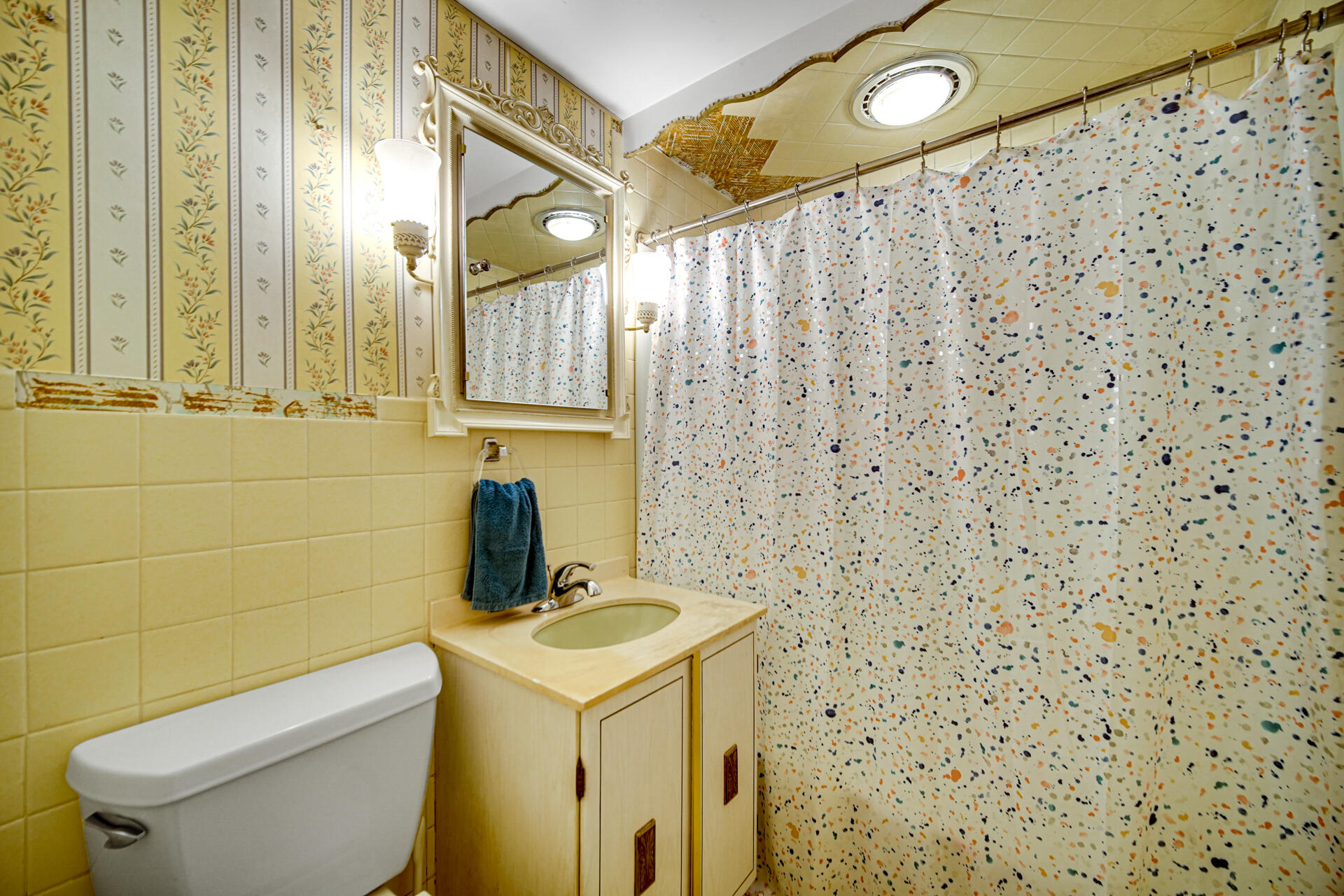 12 South Fish Lake Road Valparaiso, IN 46385 - Photo 16 of 21 a bathroom with a toilet sink and mirror