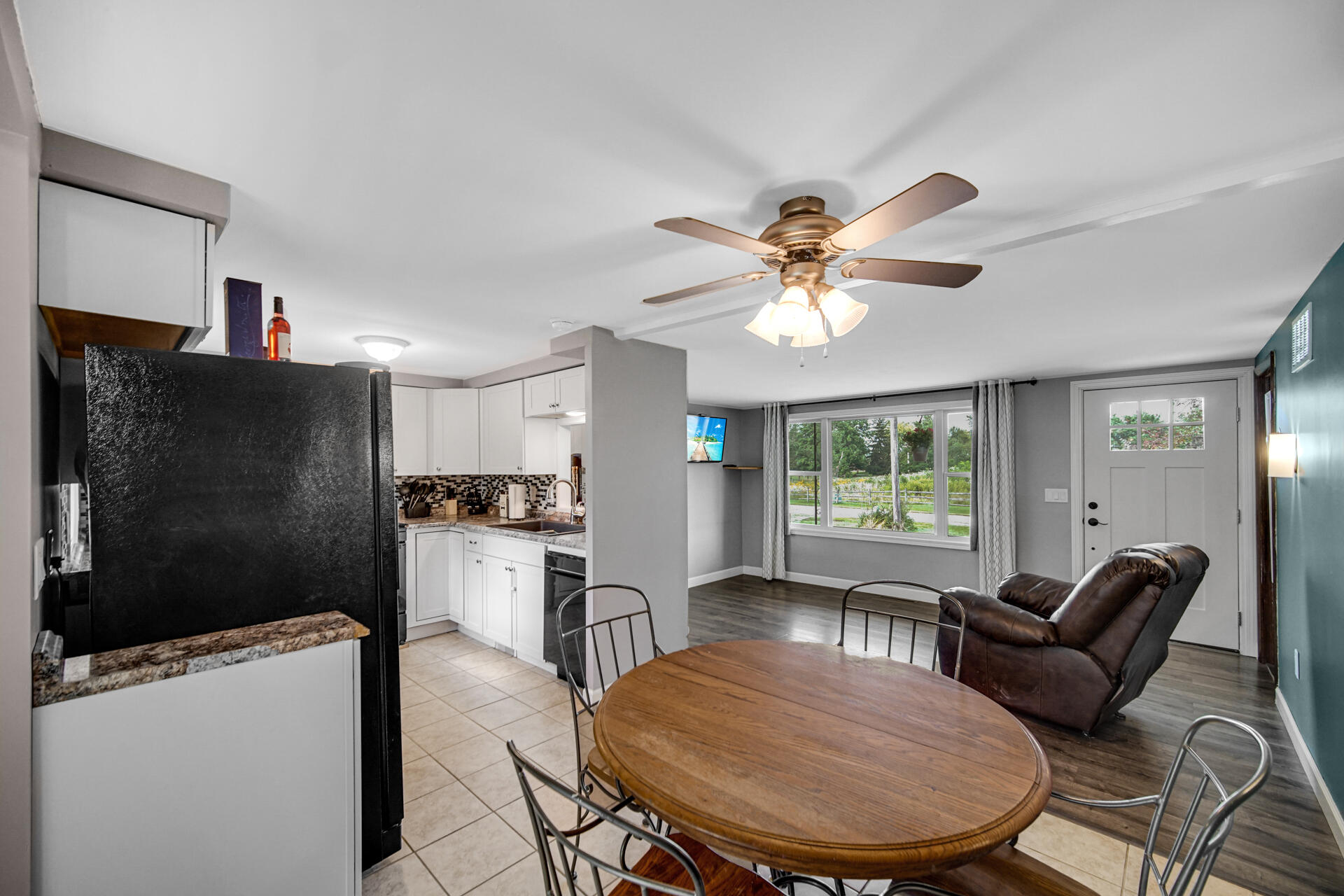 12 South Fish Lake Road Valparaiso, IN 46385 - Photo 5 of 21 a view of a dining room with furniture a livingroom and chandelier