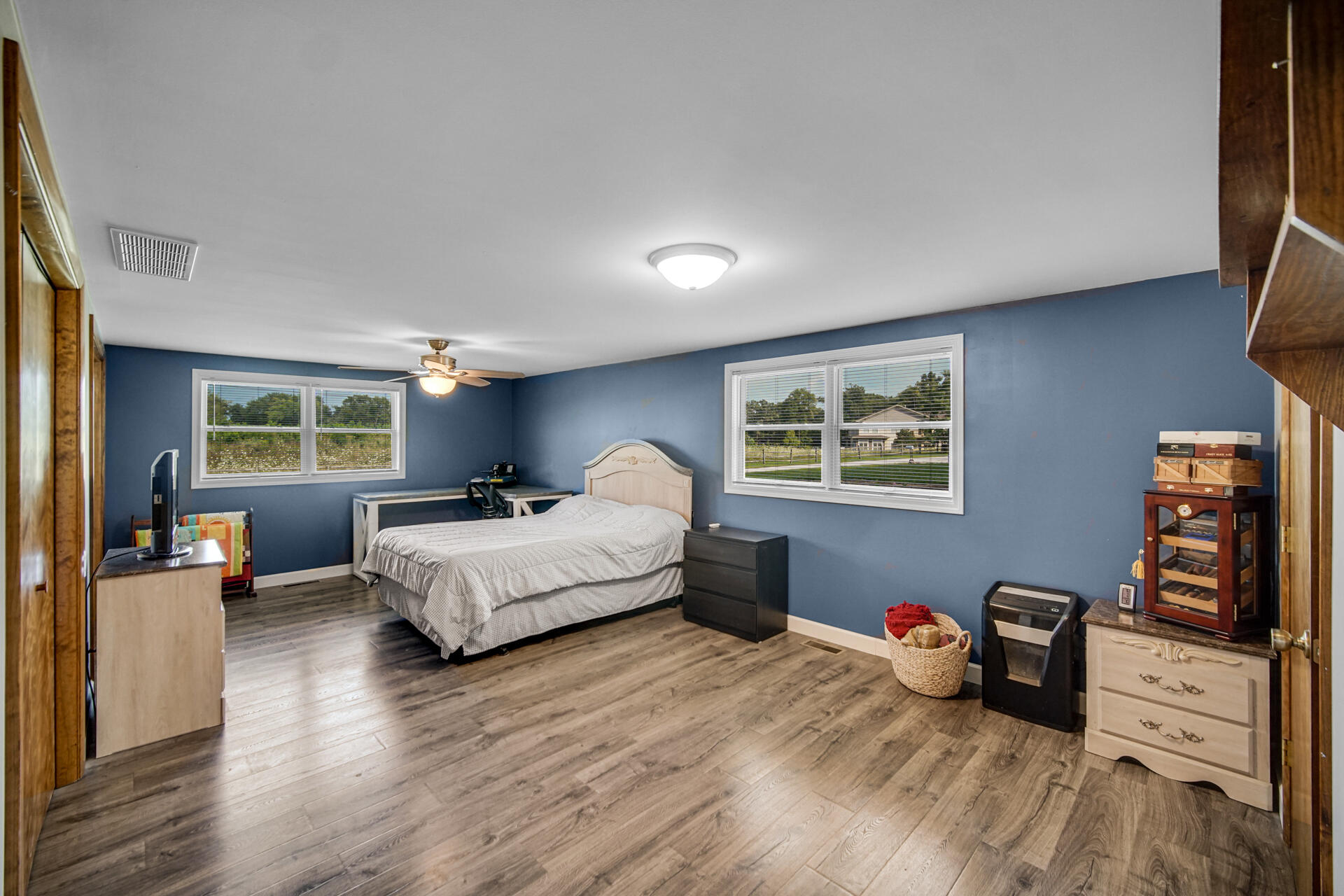 12 South Fish Lake Road Valparaiso, IN 46385 - Photo 10 of 21 a bedroom with furniture and a wooden floor