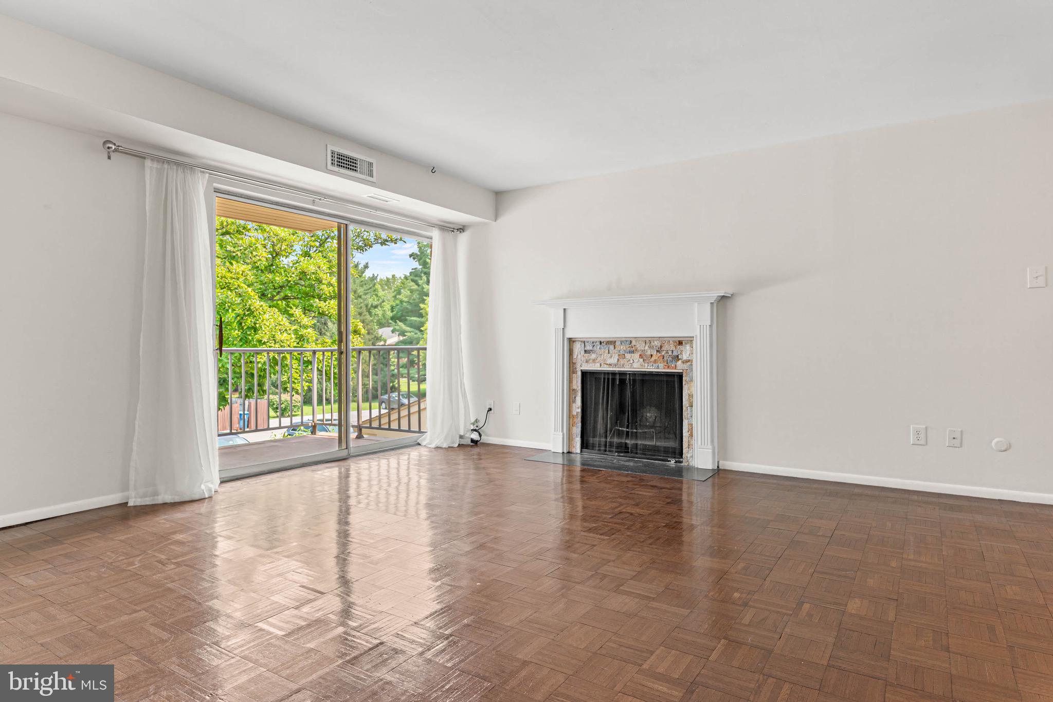 423 Old Forge Crossing, Unit 423 Devon, PA 19333 - Photo 4 of 24 Living Room w/ fireplace