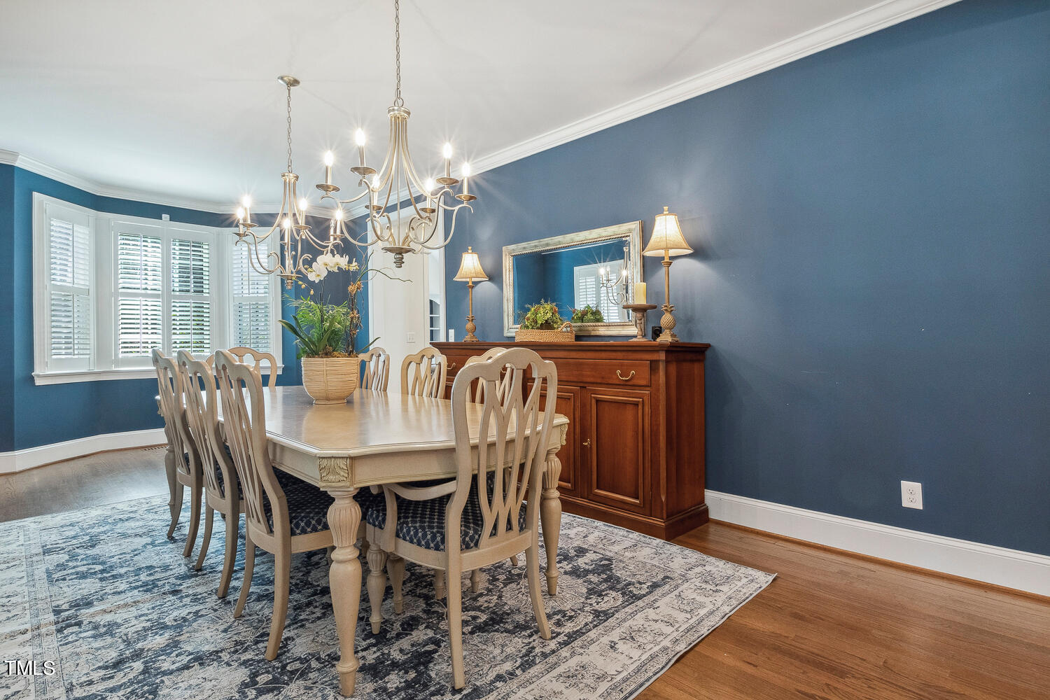 5012 Boulder Creek Lane Raleigh, NC 27613 - Photo 15 of 100 a view of a dining room with furniture and chandelier