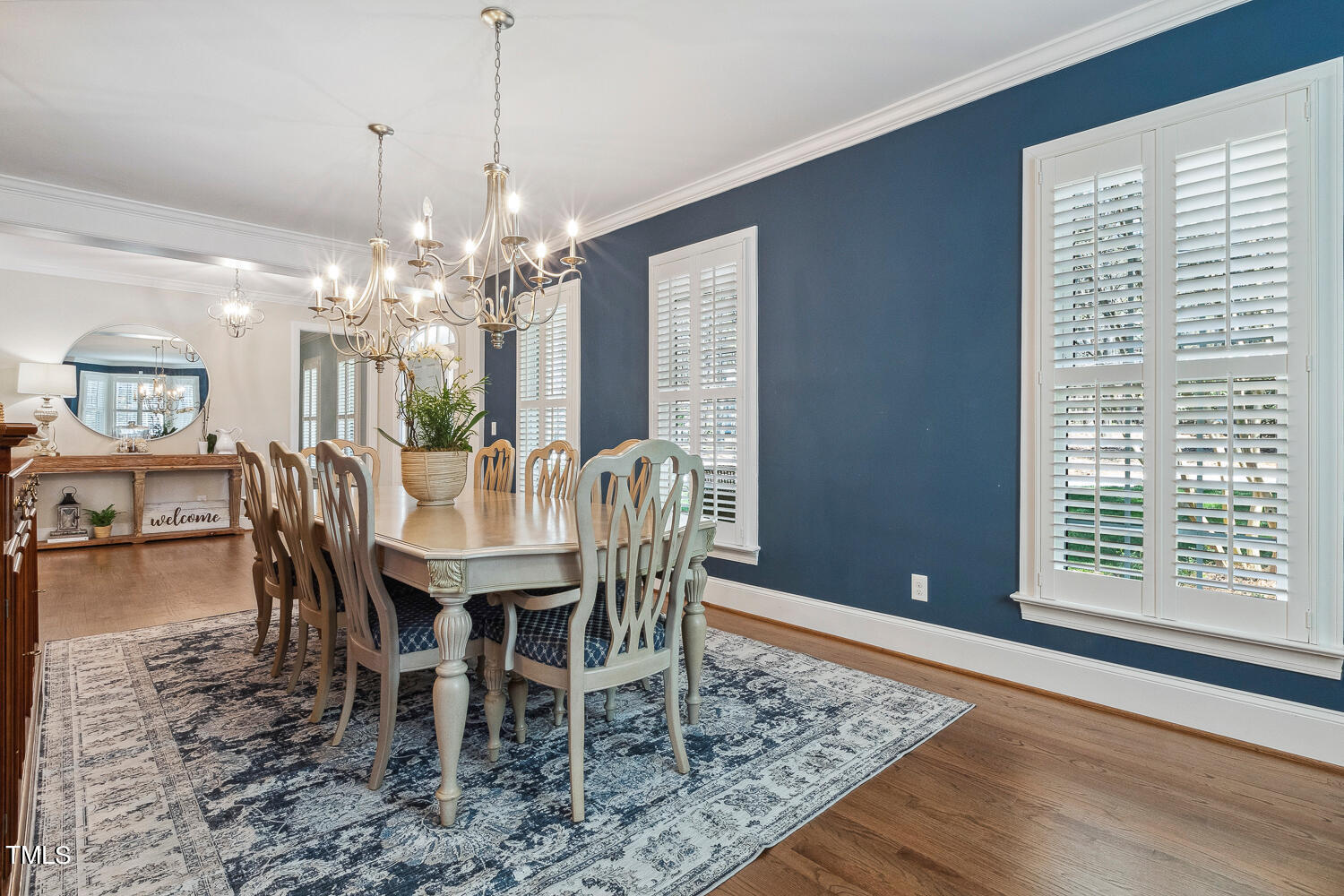 5012 Boulder Creek Lane Raleigh, NC 27613 - Photo 17 of 100 a view of a dining room with furniture and chandelier