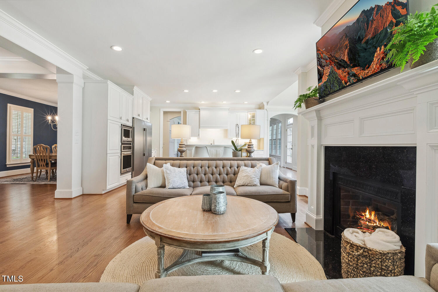 5012 Boulder Creek Lane Raleigh, NC 27613 - Photo 18 of 100 a living room with furniture a table and kitchen view