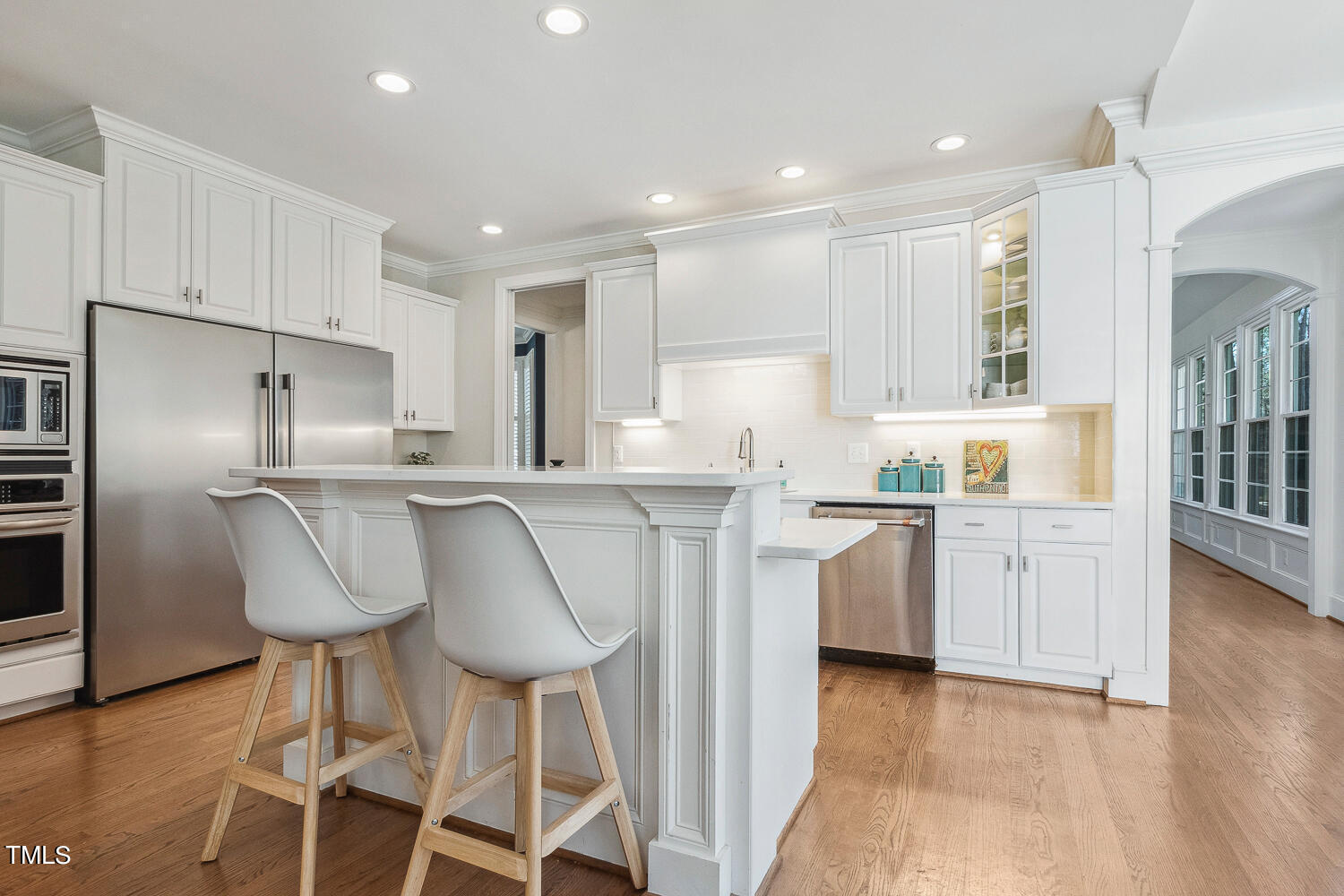 5012 Boulder Creek Lane Raleigh, NC 27613 - Photo 24 of 100 a kitchen with granite countertop white cabinets and stainless steel appliances