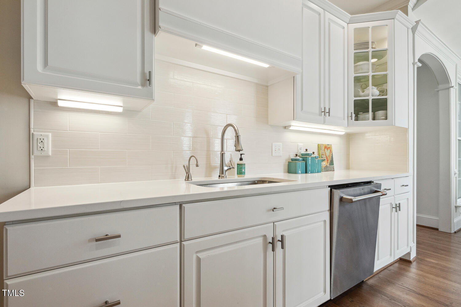 5012 Boulder Creek Lane Raleigh, NC 27613 - Photo 30 of 100 a kitchen with white cabinets and a sink