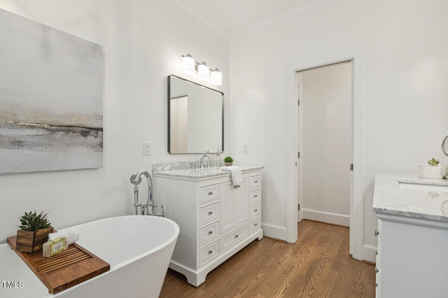 5012 Boulder Creek Lane Raleigh, NC 27613 - Photo 54 of 100 a bathroom with a double vanity sink mirror and bathtub