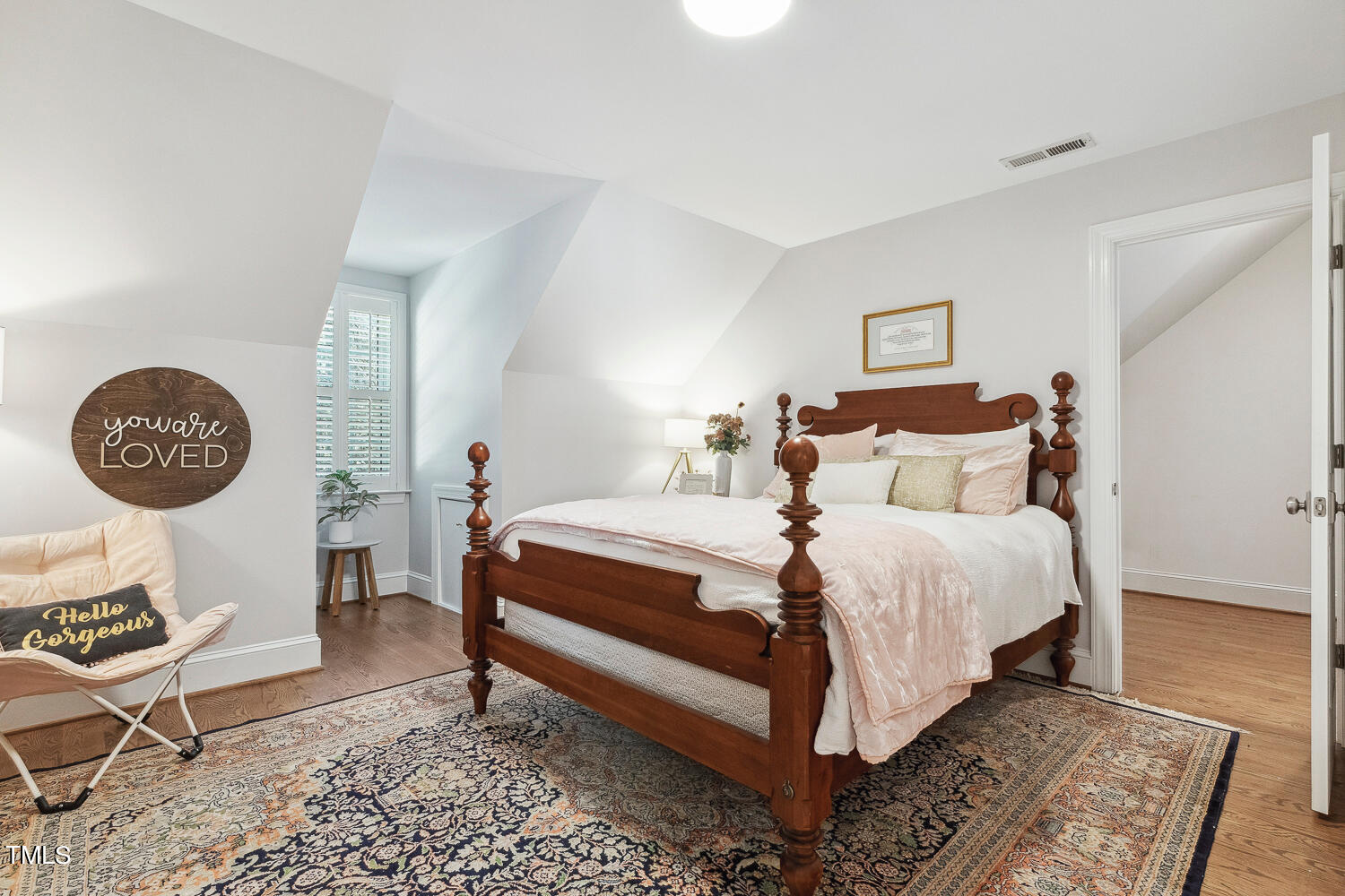 5012 Boulder Creek Lane Raleigh, NC 27613 - Photo 65 of 100 a bedroom with a bed and a table in it