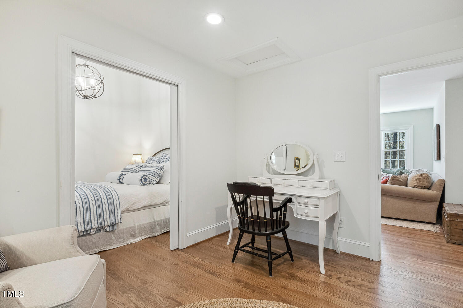 5012 Boulder Creek Lane Raleigh, NC 27613 - Photo 72 of 100 a bedroom with furniture and a wooden floor