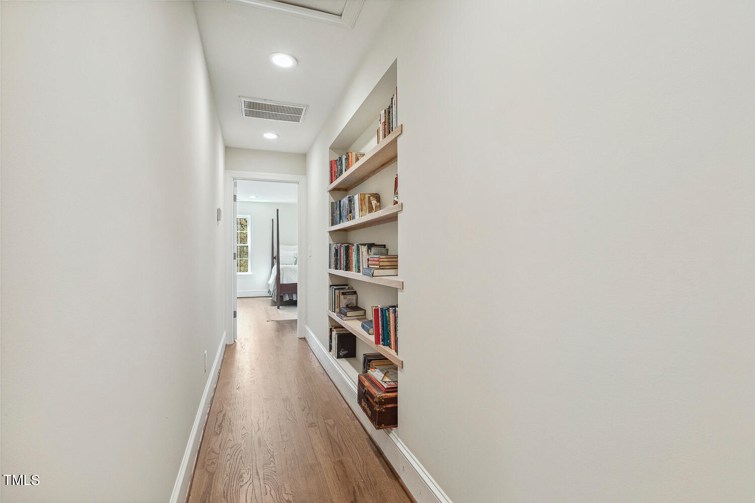 5012 Boulder Creek Lane Raleigh, NC 27613 - Photo 79 of 100 a view of a hallway with wooden floor and closet