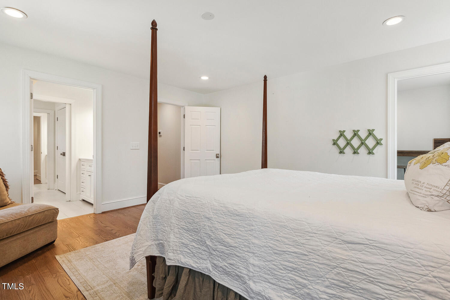 5012 Boulder Creek Lane Raleigh, NC 27613 - Photo 82 of 100 a bedroom with a large bed and a couch