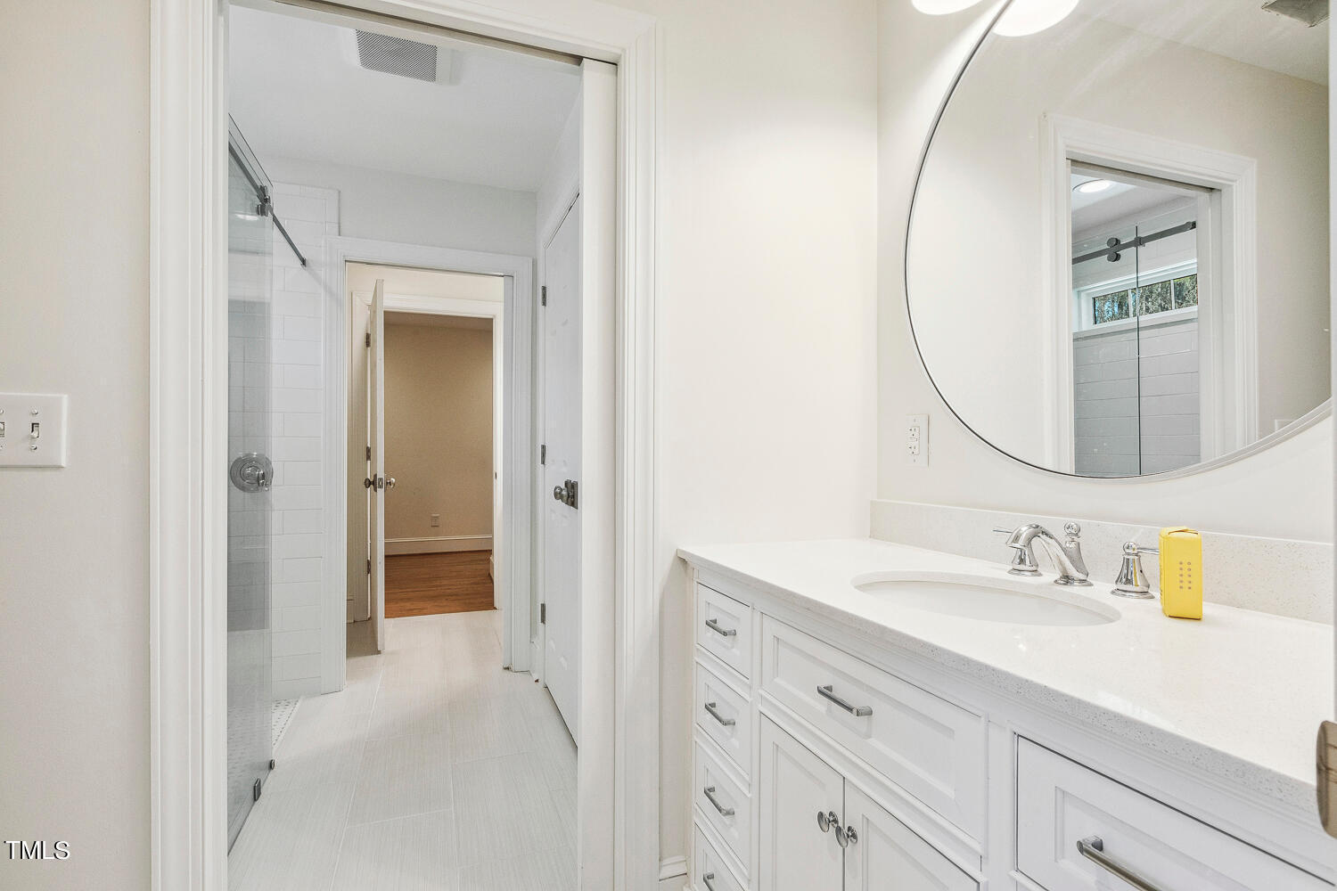 5012 Boulder Creek Lane Raleigh, NC 27613 - Photo 84 of 100 a en suite bathroom with a sink and a mirror