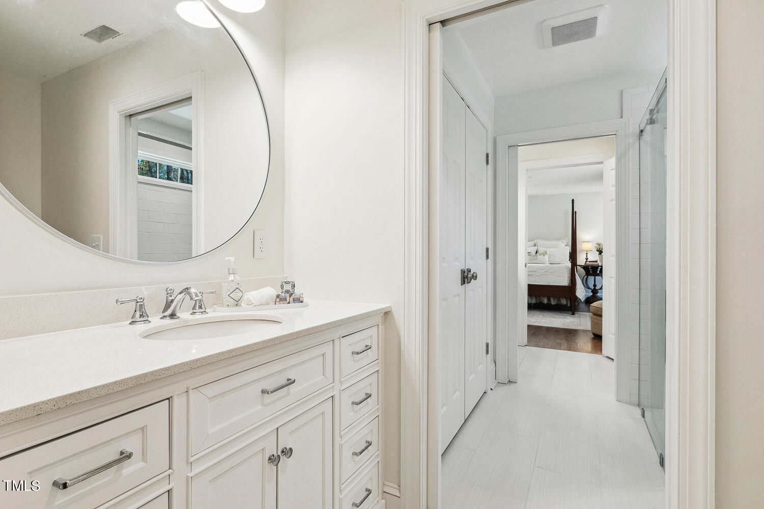 5012 Boulder Creek Lane Raleigh, NC 27613 - Photo 87 of 100 a en suite bathroom with a sink and a mirror