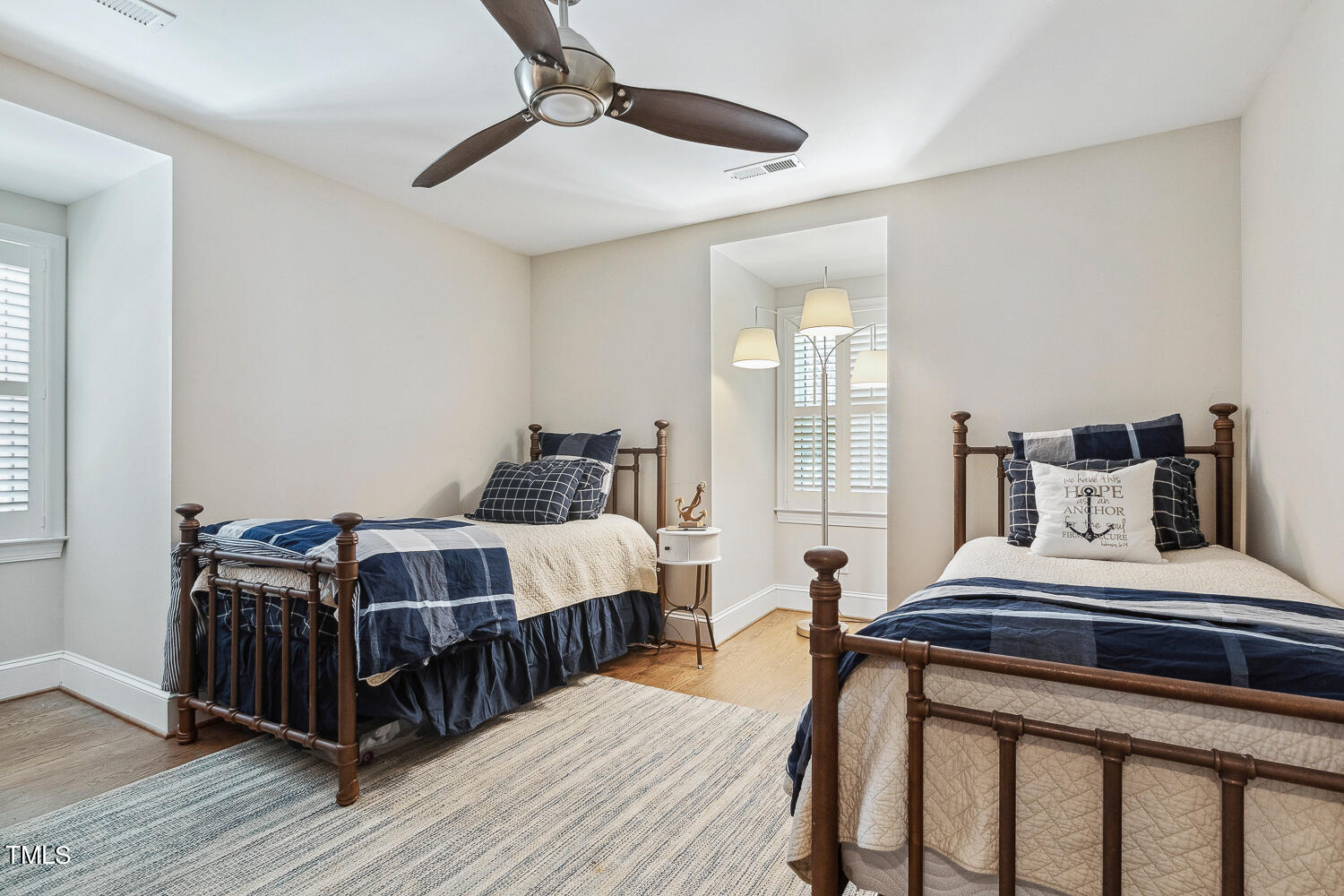 5012 Boulder Creek Lane Raleigh, NC 27613 - Photo 88 of 100 a bedroom with a bed and wooden floor