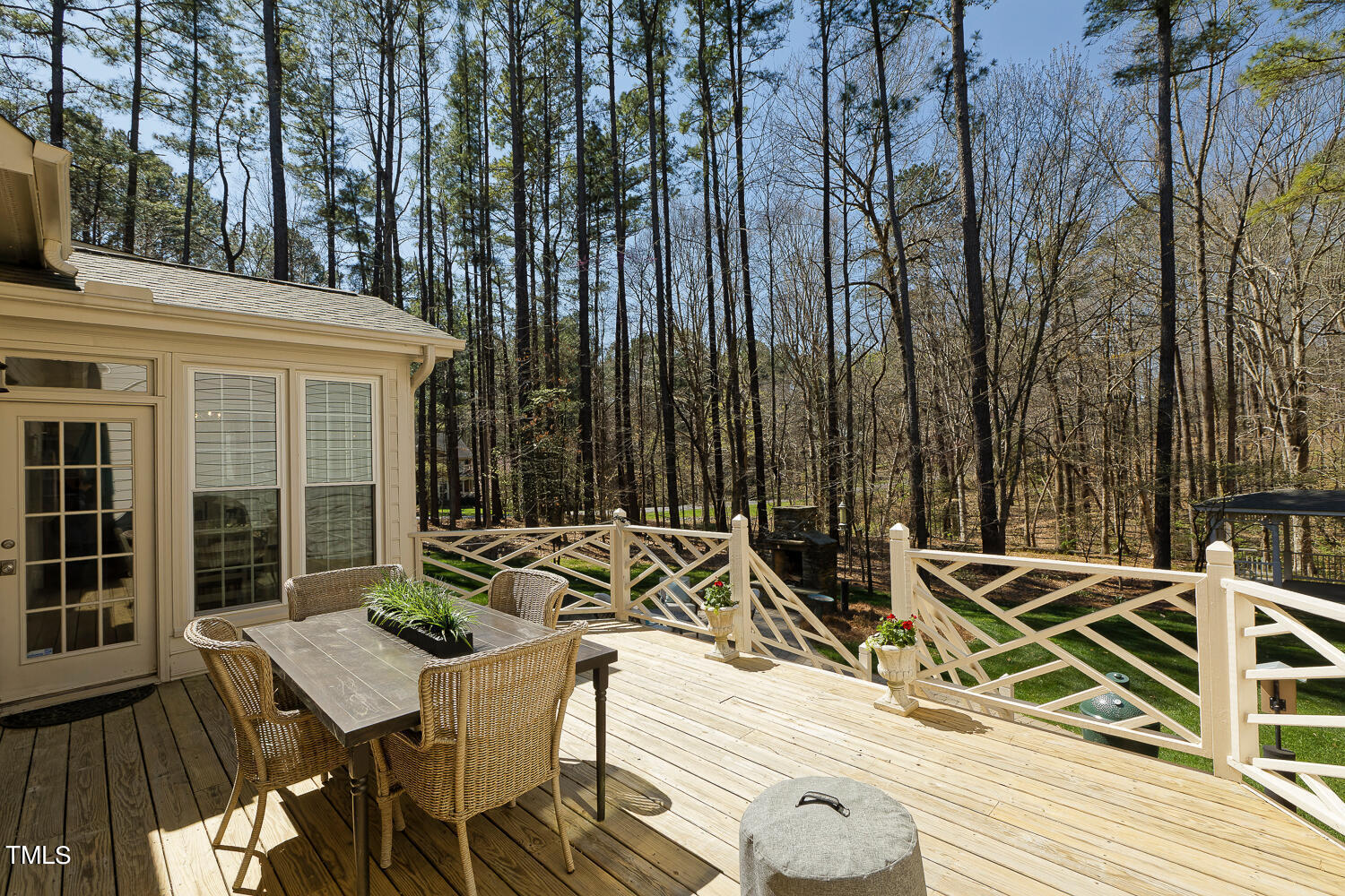 5012 Boulder Creek Lane Raleigh, NC 27613 - Photo 91 of 100 a view of a patio with table and chairs with wooden floor and fence