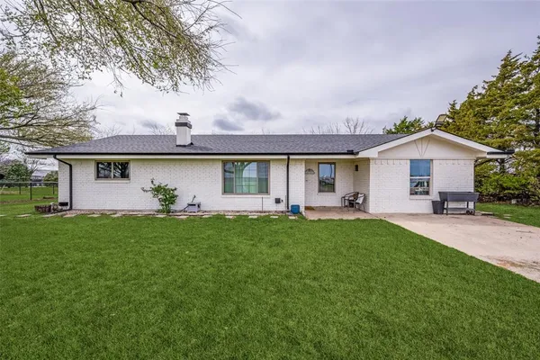 front view of a house with a garden