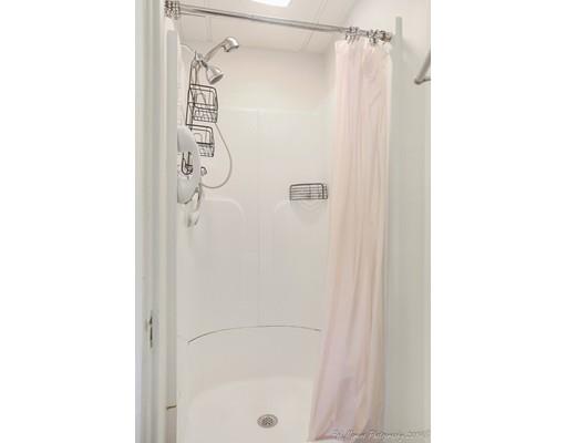 14 Overlook Road Wakefield, MA 01880 - Photo 12 of 28 a bathroom with a shower and a glass door