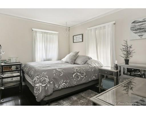 14 Overlook Road Wakefield, MA 01880 - Photo 18 of 28 a bedroom with a bed a table and chair