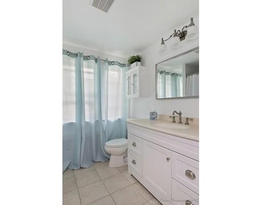 14 Overlook Road Wakefield, MA 01880 - Photo 19 of 28 a bathroom with a toilet a sink and mirror
