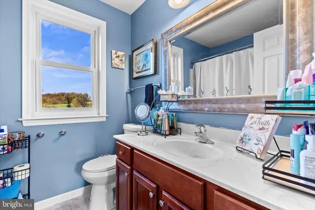 a bedroom with bed and a window