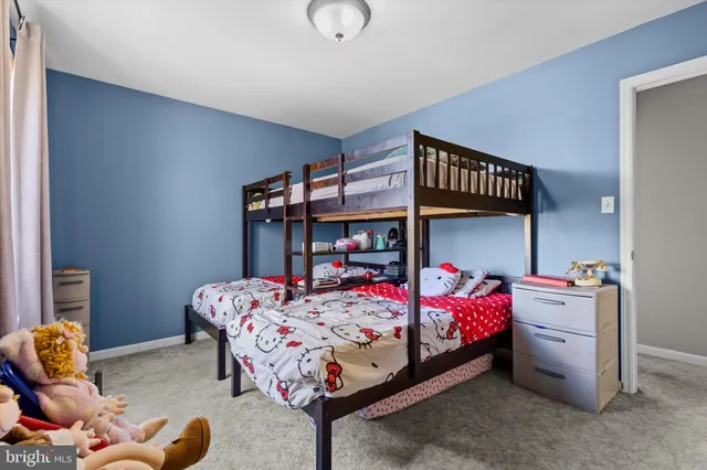 a bedroom with bed and a window