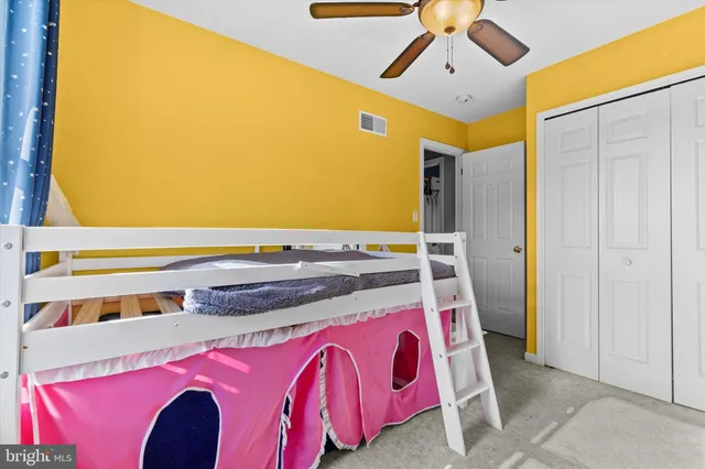 a bedroom with furniture wooden floor and flat screen tv