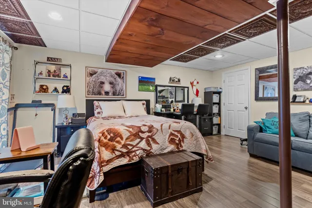 a bathroom with a sink vanity mirror and toilet