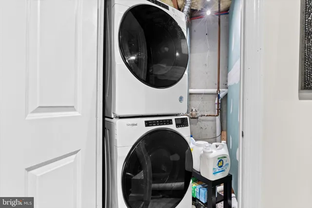 a balcony with table and chairs