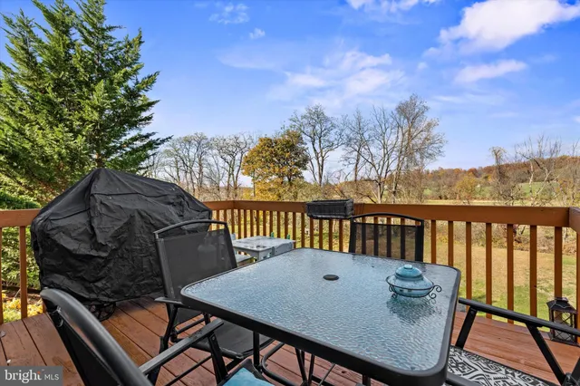 a view of a patio with a table and chairs