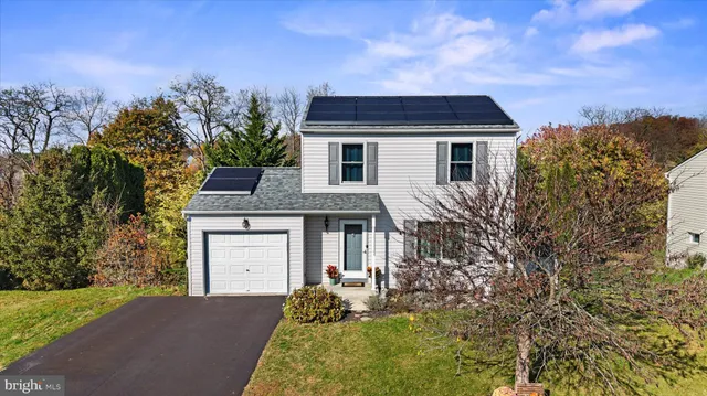 a aerial view of a house with a yard