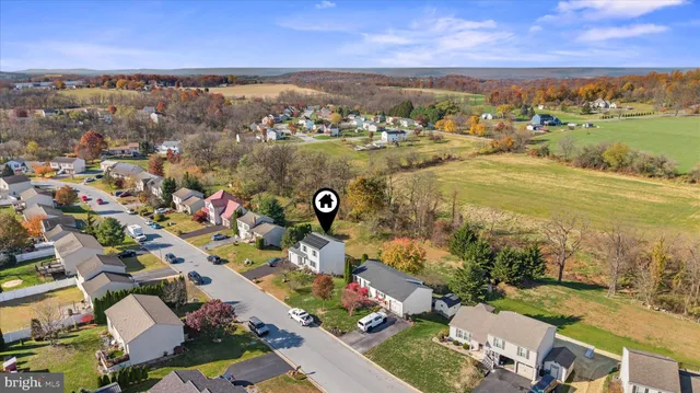 an aerial view of a house with a lake view