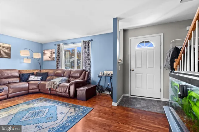 a living room with furniture and a rug