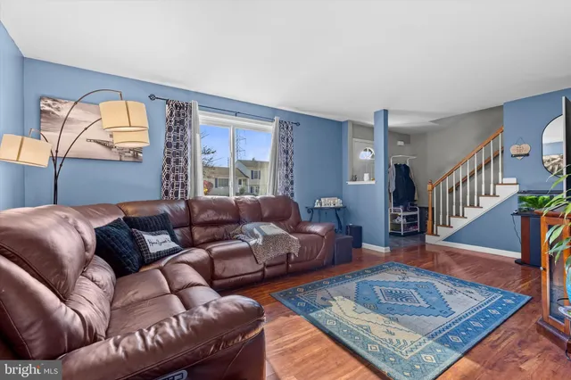 a living room with furniture and a rug