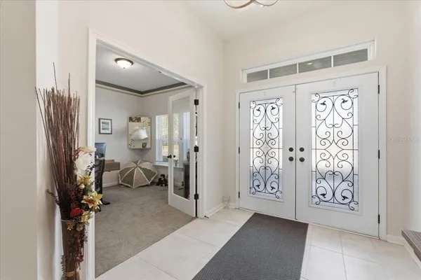 a view of a livingroom with furniture and closet area