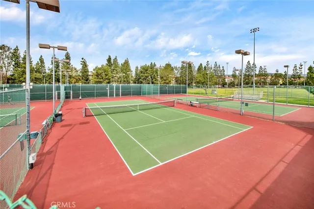a view of an outdoor space and tennis court
