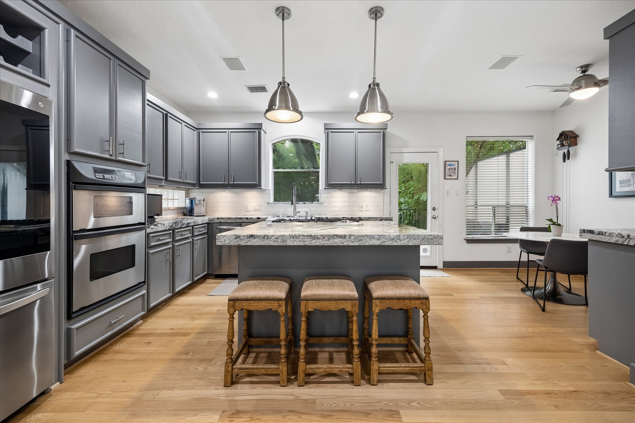 6406 Rodrigo Street, Unit B Houston, TX 77007 - Photo 10 of 27 Island kitchen with breakfast bar and two pendants light. Kitchen has ample counter and cabinet storage.